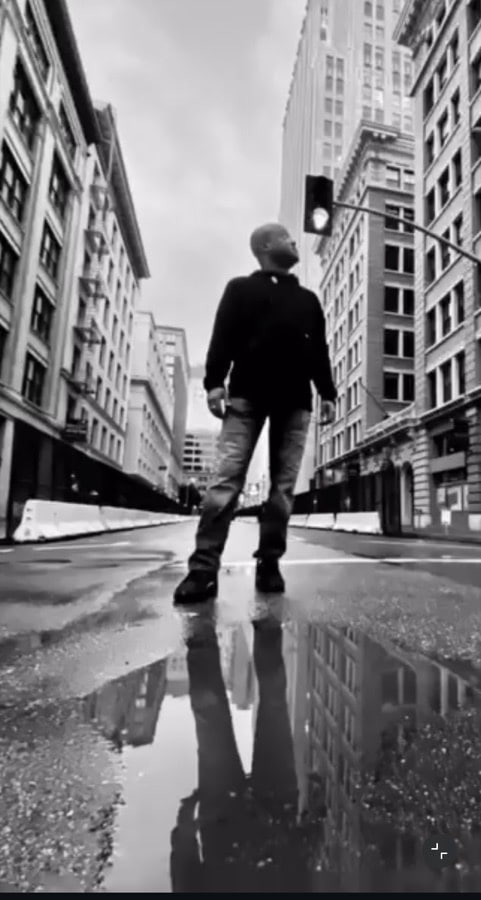 Okorie Okorocha standing on a city street